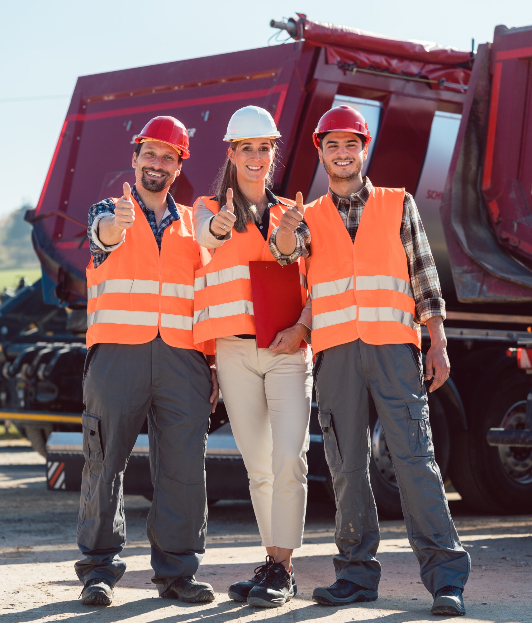 Colleagues in a freight forwarding company giving thumbs up
